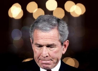US President Bush looks down during a press conference in the East Room of the White House, December 19, 2005. [Reuters]