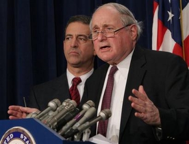 Sen. Carl Levin, D-Mich., right, accompanied by Sen. Russ Feingold, D-Wis., gestures during a Capitol Hill news conference to respond to President Bush's earlier news conference Monday, Dec. 19, 2005 where the president said he approved domestic spying on suspected terrorists without court orders. 'Where does he find in the Constitution the authority to tap the wires and the phones of American citizens without any court oversight?' said Levin.