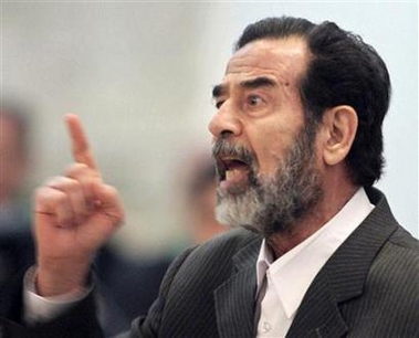 Former Iraqi president Saddam Hussein is seen during his trial in Baghdad, December 6, 2005.