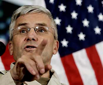 General George Casey, Commanding General Multi-National Force Iraq, speaks during a news conference in Baghdad, Iraq, December 23, 2005. Casey was commenting on the reduction in the size of the U.S. force in Iraq by two combat brigades by next year. 