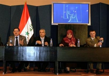 Craig Jenness, a United Nations official, far right, and Ferid Ayar, far left, an Iraqi Electoral Commission official, address a news conference organized by the Independent Electoral Commission of Iraq, or IECI, in Baghdad, Iraq, Wednesday Dec. 28, 2005