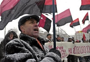Protesters hold flags of the Congress of Ukrainian Nationalists party during a protest against Russia's plans to increase gas prices for Ukraine, at the Russian Embassy in Kiev, Ukraine, Tuesday, Dec. 27, 2005.
