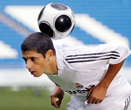 Real Madrid's new player, Brazilian defender Cicinho, heads the ball during his presentation ceremony at Santiago Bernabeu stadium in Madrid December 29, 2005. 