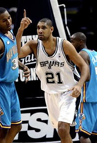 San Antonio Spurs Tim Duncan (21) gestures with the number one sign after scoring two of his 17 points to the dismay of New Orleans Hornets David West (30) during second half NBA basketball action at the SBC Center in San Antonio Thursday Dec. 29, 2005