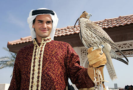 Tennis player Roger Federer of Switzerland poses while wearing traditional Qatari clothes, during the second day of the Qatar Open tennis tournament, in the outskirts of Doha January 3, 2006.[Reuters] 