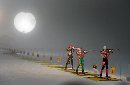 (R-L) Sandrine Bailly of France, Olena Zubrilova of Belarus and Kati Wilhelm of Germany shoot during the 4 x 6 km women's relay race at the Biathlon World Cup in the German wintersport resort of Oberhof January 5, 2006. [Reuters]