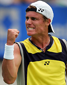 Australia's Lleyton Hewitt reacts after breaking the serve of Austria's Jurgen Melzer during their second round match at the Sydney International tennis tournament January 11, 2006. 