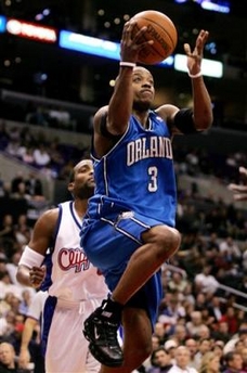 Orlando Magic's Steve Francis, right, goes up to the basket past Los Angeles Clippers' Cuttino Mobley, left, during the first quarter of an NBA basketball game, Tuesday, Jan. 10, 2006, in Los Angeles.