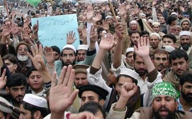 Angry protesters chant anti-U.S. slogans during a protest in Peshawar, Pakistan on Sunday, Jan. 15, 2006. 