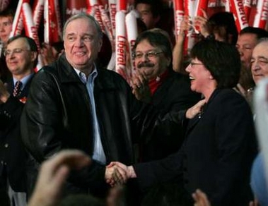Liberal leader and Canadian Prime Minister Paul Martin (front L) greets deputy leader Anne McLellan (R) during a rally in Edmonton, Canada January 15, 2006.