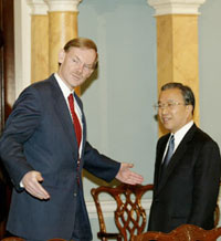 Chinese Vice Foreign Minister Dai Bingguo is welcomed by US Deputy Secretary of State Robert Zoellick in Washington, December 8, 2005. Two of the world's most powerful nations have kicked off a new round of strategic talks in Washington, to underscore their shared responsibilities as "stake-holders" in the global economic and security system and manage some frictions in their increasingly complex relationship. [Xinhua]