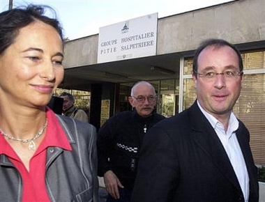 French socialist party secretary general Francois Hollande, right, and his companion Segolene Royal, leave the Pitie-Salpetriere hospital after visiting Paris Mayor Bertrand Delanoe, in Paris in this Oct.6, 2002 file photo. 