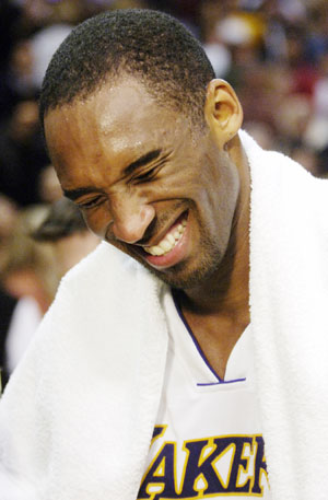 Los Angeles Lakers' Kobe Bryant smiles after his 81-point performance against the Toronto Raptors in Los Angeles January 22, 2006. Bryant set a personal career high, and the performance is the second-highest single scoring total in NBA history. 