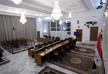 This general view of the interior of the courtroom where the trial of Saddam Hussein and seven co-defendants is being held, at an undisclosed location in the heavily fortified Green Zone in Baghdad Iraq, seen in this Dec. 8, 2005 file photo.