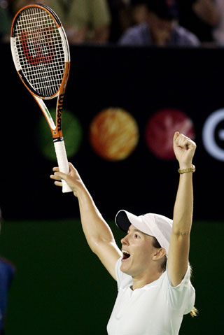 Justine Henin-Hardenne of Belgium reacts after winning her match against Maria Sharapova of Russia at the Australian Open tennis tournament in Melbourne January 26, 2006. 