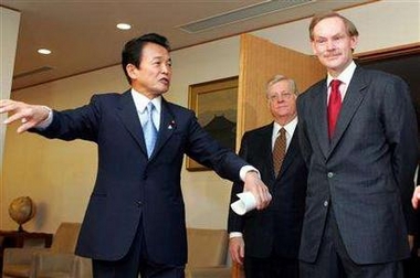 Deputy Secretary of State Robert Zoellick is welcomed by Japan's Foreign Minister Taro Aso upon arriving in Tokyo, January 23, 2006. 