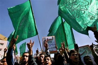 Palestinian supporters of Hamas shout slogans during a protest against cartoons published in several European newspapers, in front of the Palestinian parliament in Gaza Strip, February 7, 2006.