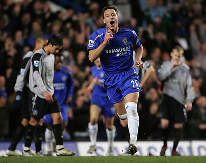 Chelsea's captain John Terry (C) celebrates his goal during their FA Cup fourth round replay soccer match against Everton at Stamford Bridge in London February 8, 2006. 