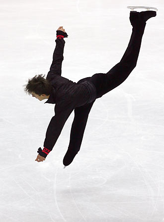 Ivan Dinev from Bulgaria performs during the men's figure skating free program at the Torino 2006 Winter Olympic Games in Turin, Italy, February 16, 2006. [Reuters]