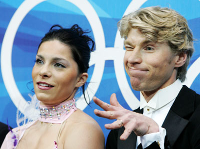 Isabelle Delobel and Olivier Schoenfelder from France react after the figure skating pairs compulsory dance at the Torino 2006 Winter Olympic Games in Turin, Italy, February 17, 2006.