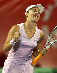 Martina Hingis of Switzerland celebrates after defeating Sania Mirza of India during their Dubai Open tennis tournament in Dubai, United Arab Emirates, February 21, 2006. 