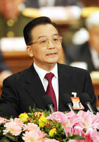 Chinese Premier Wen Jiabao delivers a speech during the opening of the National People's Congress at the Great Hall of the People in Beijing March 5, 2006. The Premier promised a economic growth rate of 8% for 2006, and a massive US$420b spending to improve the rural sector. [Xinhua]