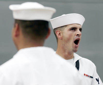  crewman from the USS Park Royal guided missile cruiser yawns as he waits for the U.S. Secretary of State Condoleezza Rice's arrival at a naval base in Sydney March 16, 2006. Rice is on a three-day visit to Australia. 