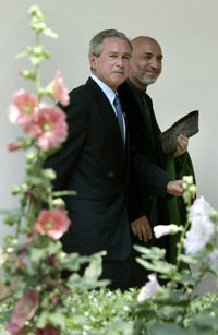 Bush touts Afghanistan as model for Iraq