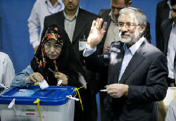 Iran's Ahmadinejad, rival both claim election win