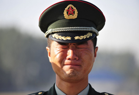 Parade soldiers start to retreat from drill camps