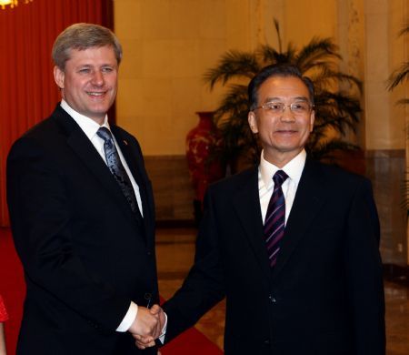 President Hu meets Canadian PM to cement ties