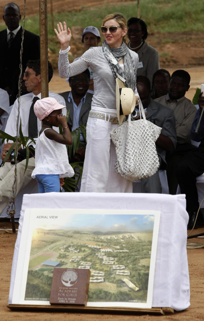 Madonna and her adopted child at site of her Raising Malawi Girls Academy