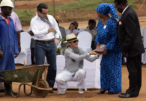 Madonna and her adopted child at site of her Raising Malawi Girls Academy