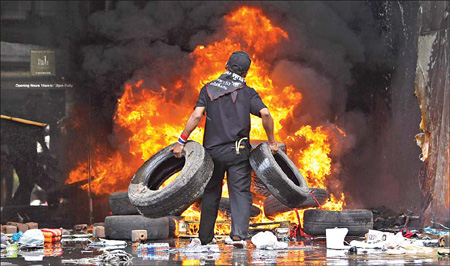 Bangkok in flames after protest leaders surrender