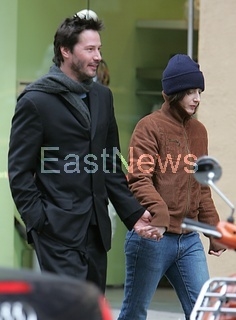 Keanu Reeves strolls with girlfriend