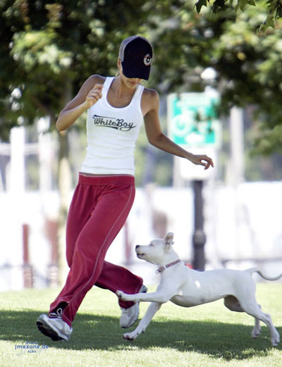 Jessica Alba plays with her dog