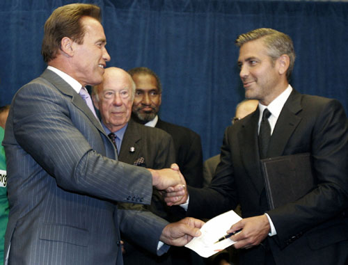 George Clooney presents Schwarzenegger's legislation signing