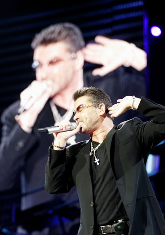 George Michael performs at the OAKA Stadium