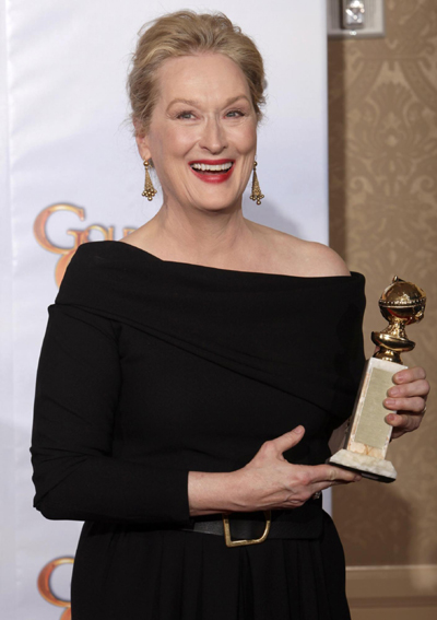 Meryl Streep holds her award for 