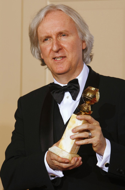 James Cameron poses with his award best motion picture for 