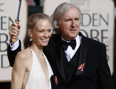 James Cameron poses with his award best motion picture for 