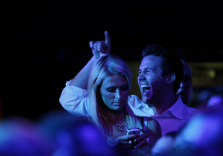 Paris Hilton and Doug Reinhardt watch performance