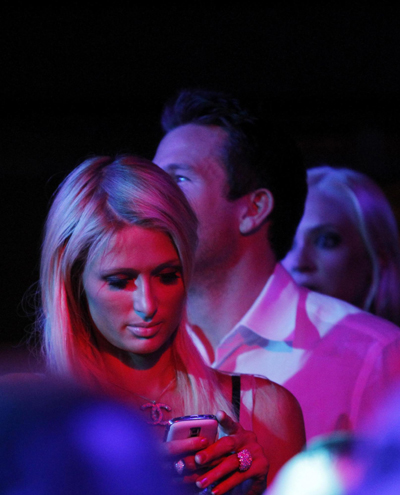 Paris Hilton and Doug Reinhardt watch performance