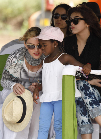 Madonna and her adopted child at site of her Raising Malawi Girls Academy