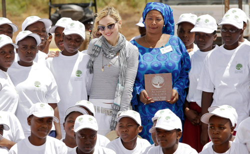 Madonna and her adopted child at site of her Raising Malawi Girls Academy