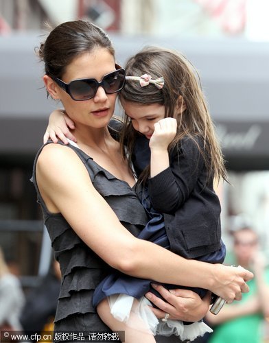 Katie Holmes and Suri seen leaving a house