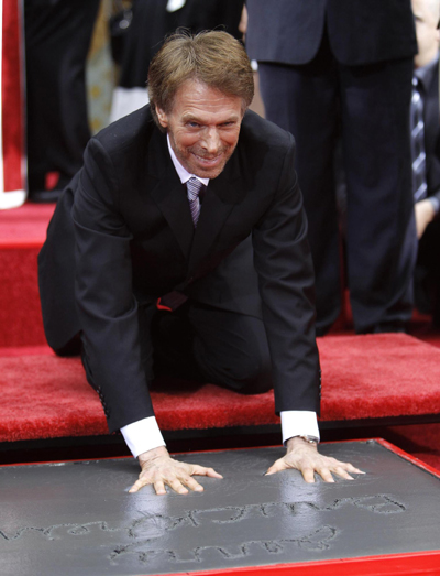 Actors Nicolas Cage and Tom Cruise attend hand and footprints ceremony for producer Jerry Bruckheimer