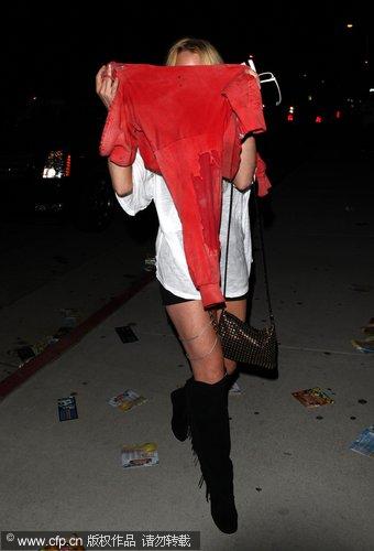 Lindsay Lohan covered head at EDC Rave Dance party