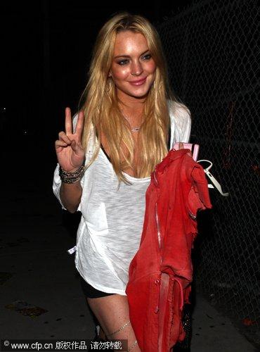 Lindsay Lohan covered head at EDC Rave Dance party