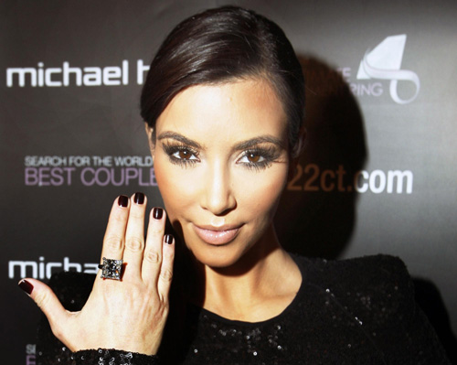 Kim Kardashian models a 22 karat princess cut diamond ring